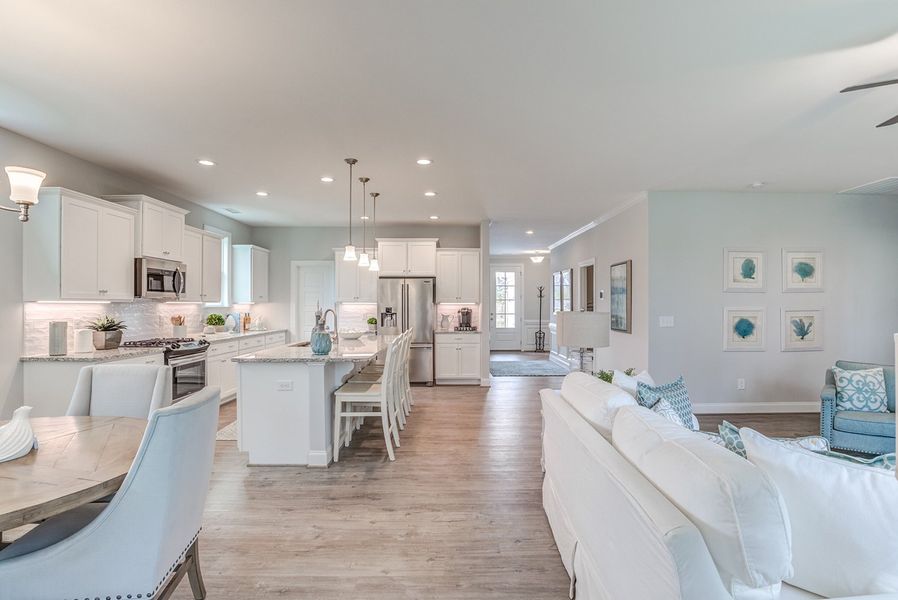 Representative furnished interior of a home built from the The Amherst by RobuckHomes in Windwater, Hampstead (Image 17).