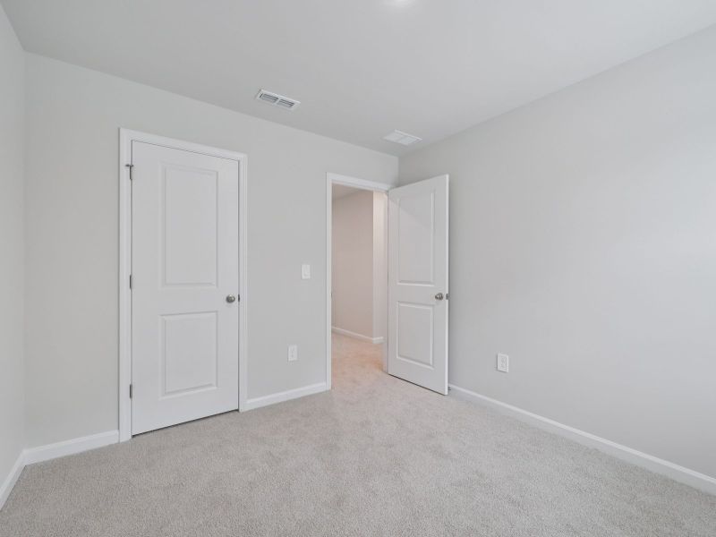 Spacious, unfurnished interior of a new home in The Rows at Buffaloe Reserve, Raleigh (Image 16).