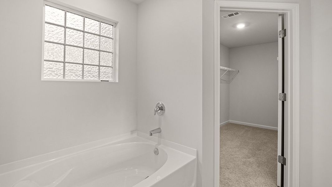 Representative furnished interior of a home built from the Mansfield by D.R. Horton in Liberty Crossing, Braselton (Image 12).