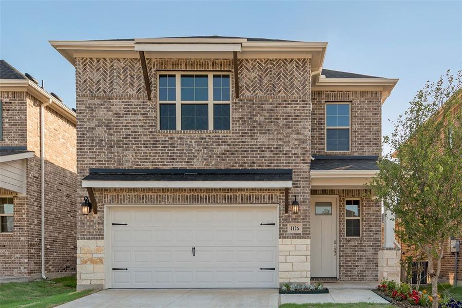 Front exterior of a new home in Walden Pond, Forney, TX, highlighting curb appeal (Image 21). Front exterior of a new home in Walden Pond, Forney, TX, highlighting curb appeal (Image 21).