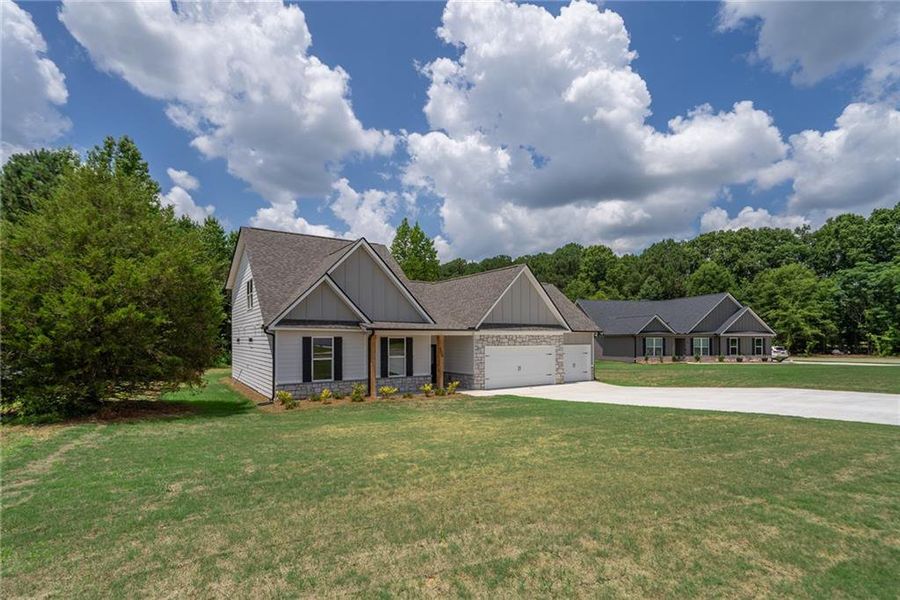 Front exterior of a new home in , Good Hope, GA, highlighting curb appeal (Image 21). Front exterior of a new home in , Good Hope, GA, highlighting curb appeal (Image 21).