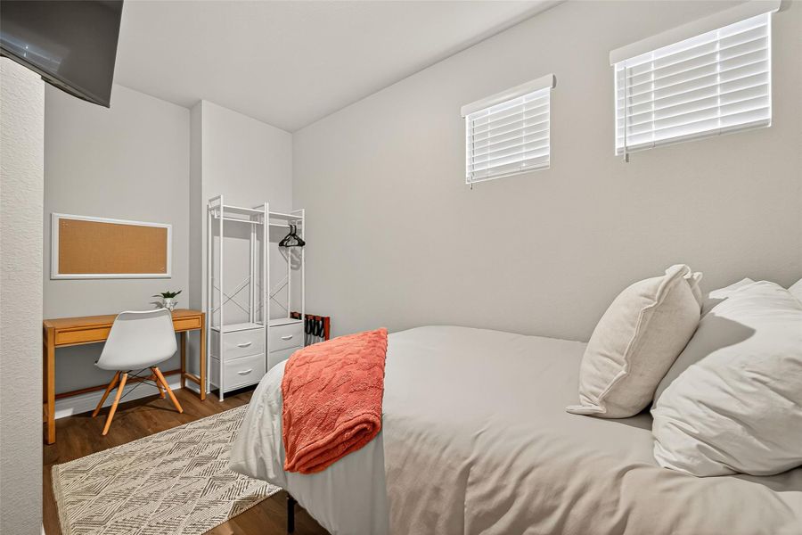 Versatile bedroom currently styled as a guest room with space for a desk — ideal for remote work, study, or flex use. Versatile bedroom currently styled as a guest room with space for a desk — ideal for remote work, study, or flex use.