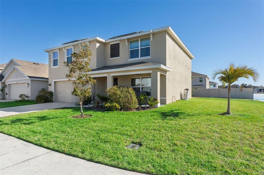 Front exterior of a new home in Zephyr Ridge, Zephyrhills, FL, highlighting curb appeal (Image 1). Front exterior of a new home in Zephyr Ridge, Zephyrhills, FL, highlighting curb appeal (Image 1).