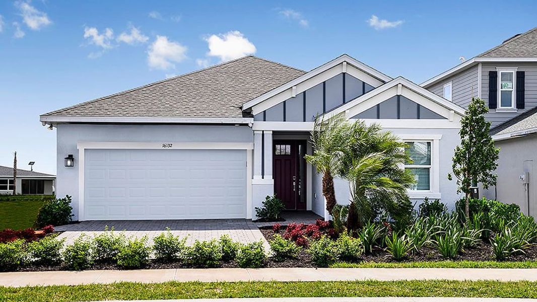 Representative exterior photo of a completed home built from the Grenada by Taylor Morrison in The Cove at West Port, Port Charlotte, FL (Image 1).
