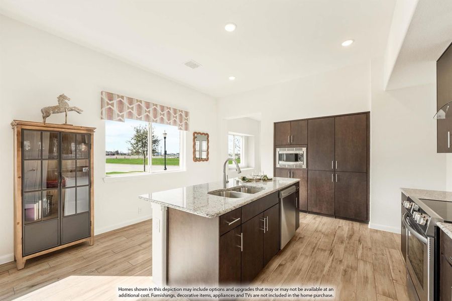 Kitchen with center island, granite countertops, dark wood cabinets, and light hardwood floors