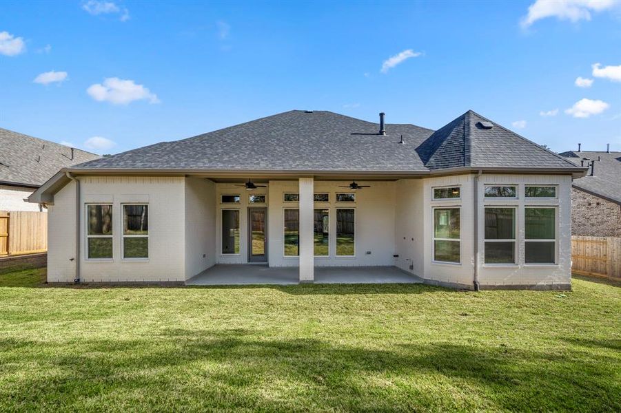 The great outdoors are calling with this oversized covered patio. It's the ideal setting for barbecues, stargazing, or simply enjoying a peaceful moment amid the lush greenery. Your oasis awaits!