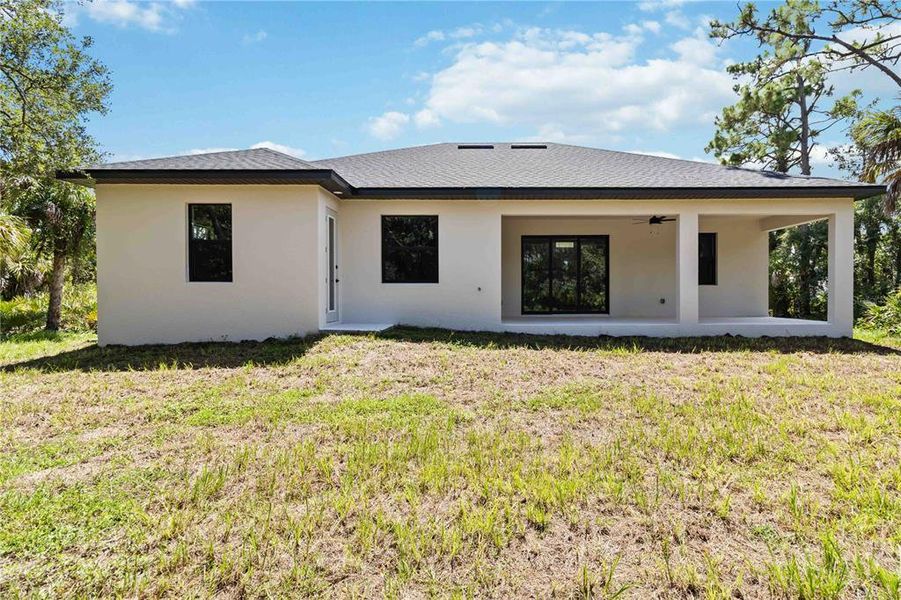 Front exterior of a new home in , Port Charlotte, FL, highlighting curb appeal (Image 17).