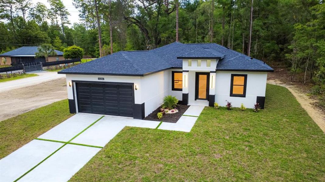 Front exterior of a new home in , Brooksville, FL, highlighting curb appeal (Image 18).
