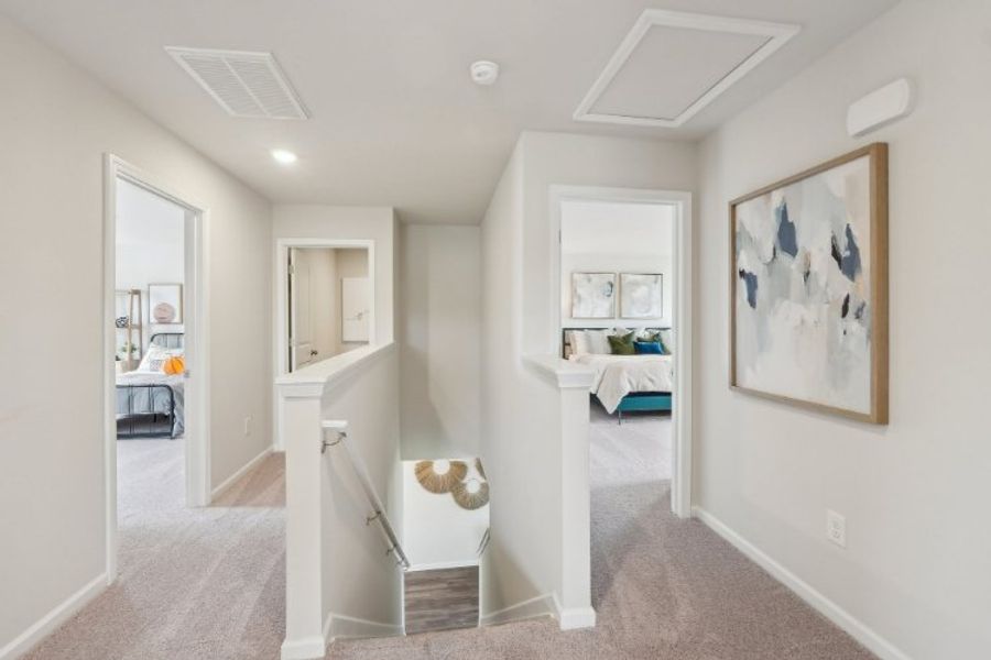 A room with a bed and a desk.