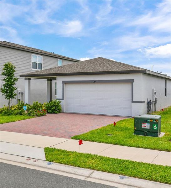 Front exterior of a new home in , Winter Haven, FL, highlighting curb appeal (Image 22). Front exterior of a new home in , Winter Haven, FL, highlighting curb appeal (Image 22).