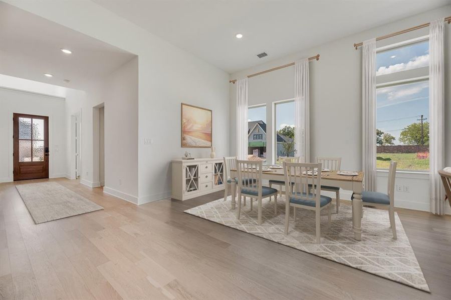 Dining room featuring recessed lighting and light wood finished floors Dining room featuring recessed lighting and light wood finished floors