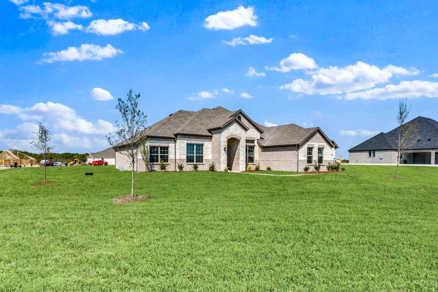 Front exterior of a new home in Berkshire Estates, Mesquite, TX, highlighting curb appeal (Image 20).