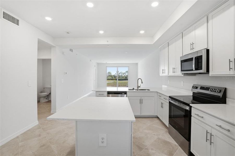 Furnished interior view inside a new home in Wellen Park Golf & Country Club, Venice (Image 7).