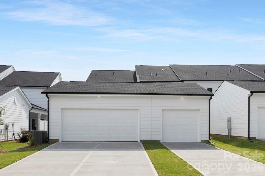 Front exterior of a new home in Edgewood Preserve, Huntersville, NC, highlighting curb appeal (Image 22).