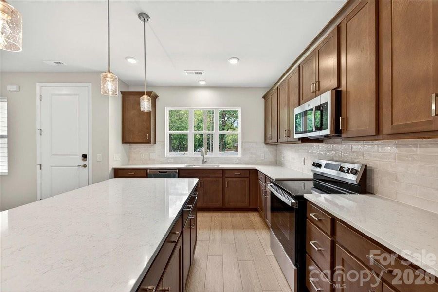 Large kitchen island and an electric range Large kitchen island and an electric range