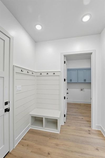 Mudroom featuring light wood-type flooring and recessed lighting Mudroom featuring light wood-type flooring and recessed lighting