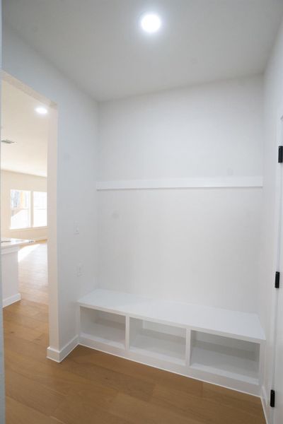 Mudroom featuring recessed lighting and wood finished floors