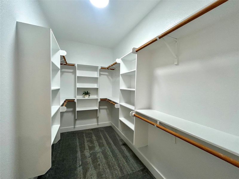Primary walk-in closet. Primary walk-in closet.