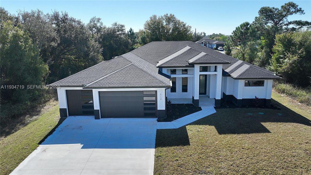 Front exterior of a new home in , Lehigh Acres, FL, highlighting curb appeal (Image 31).