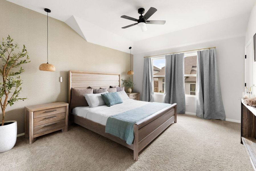 Bedroom featuring light carpet, a ceiling fan, and lofted ceiling