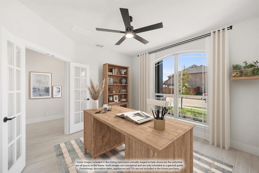 Home office with French doors, wood desk, ceiling fan, and large arched window with natural light