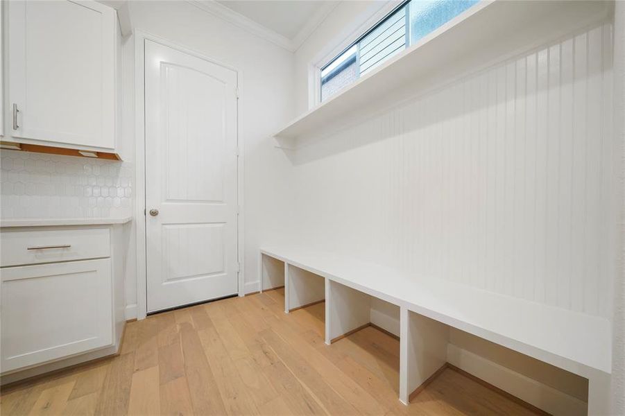 Mud Room with built-in shelving! (Sample photos of a completed Chesapeake floor plan. The image may feature alternative selections and/or upgrades.)