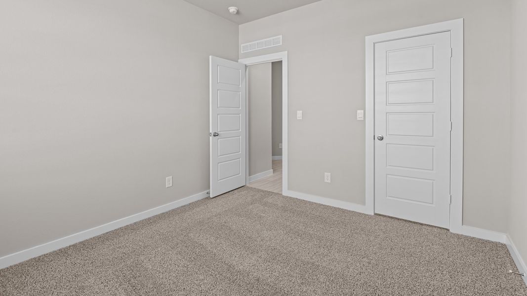 Representative unfurnished interior of a home built from the Jaxson by D.R. Horton in Legacy South, Midland (Image 25).