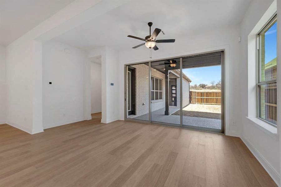 Spare room with ceiling fan and light wood-style floors