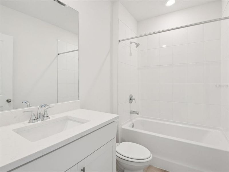 Furnished interior view inside a new home in The Grove at Stuart Crossing - Classic Series, Bartow (Image 5). Furnished interior view inside a new home in The Grove at Stuart Crossing - Classic Series, Bartow (Image 5).