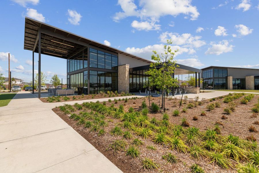 Front exterior of a new home in Sunterra, Katy, TX, highlighting curb appeal (Image 21). Front exterior of a new home in Sunterra, Katy, TX, highlighting curb appeal (Image 21).