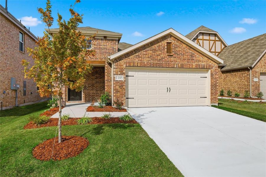 View of front facade with a front lawn, concrete driveway, brick siding, an attached garage, and roof with shingles View of front facade with a front lawn, concrete driveway, brick siding, an attached garage, and roof with shingles