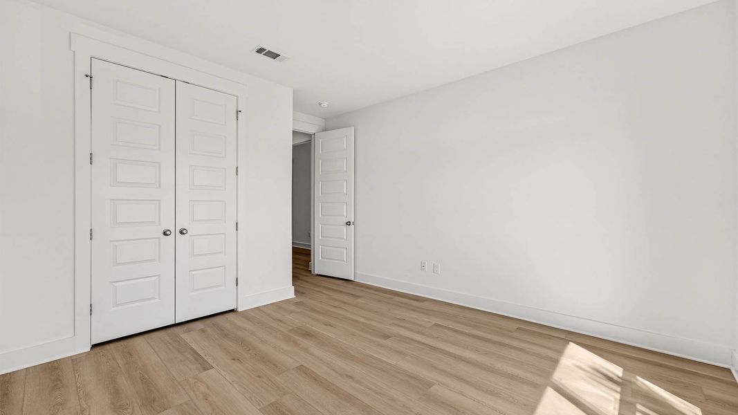 Representative unfurnished interior of a home built from the The Lily by D.R. Horton in WindMark Beach, Port Saint Joe (Image 30).