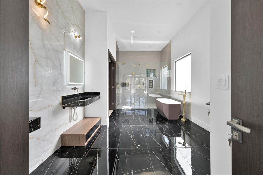 Experience luxury in this stunning primary bathroom suite!