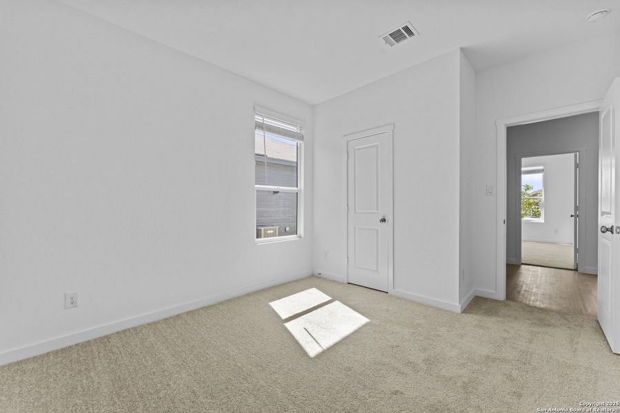 Spacious, unfurnished interior of a new home in Waterwheel: Coastline Collection, San Antonio (Image 13).