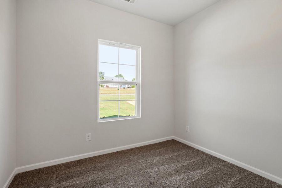 Spacious, unfurnished interior of a new home in Cambridge Reserve, Angier (Image 24).