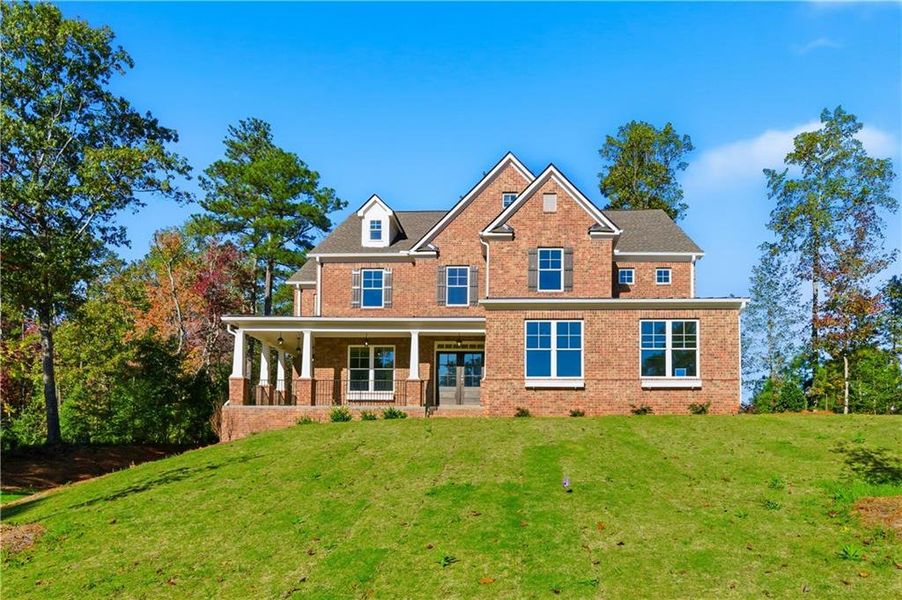 Front exterior of a new home in The Estates at Hurricane Pointe, Douglasville, GA, highlighting curb appeal (Image 24). Front exterior of a new home in The Estates at Hurricane Pointe, Douglasville, GA, highlighting curb appeal (Image 24).