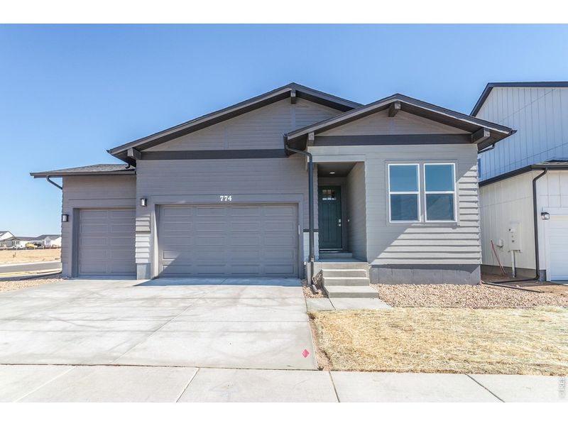 Front exterior of a new home in Prairie Song Story Collection - Single Family Homes, Windsor, CO, highlighting curb appeal (Image 26).