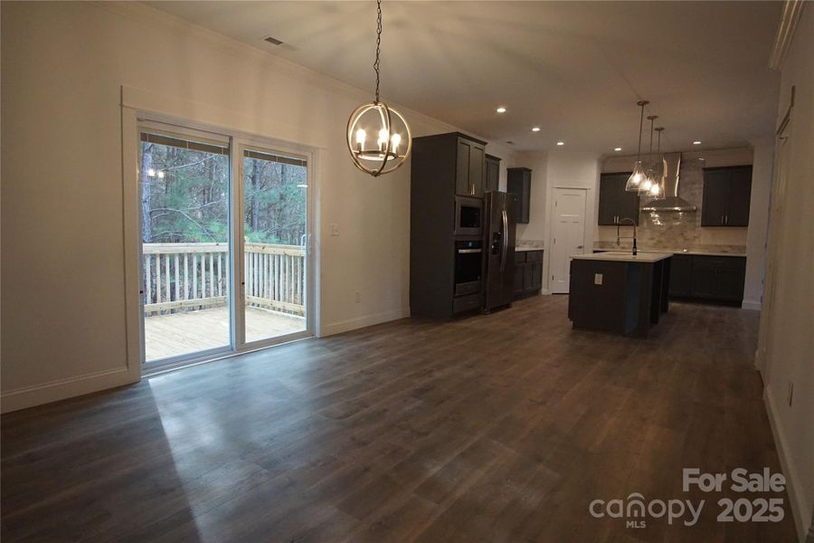 Dining area looking back to kitchen and deck Dining area looking back to kitchen and deck