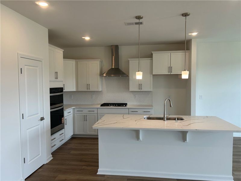 An inviting kitchen features a central island with