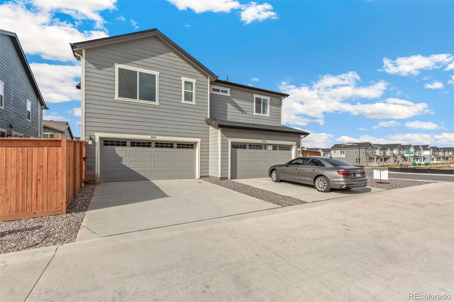Exterior details and patio area of a home in Sky Ranch Villas, Watkins (Image 4).