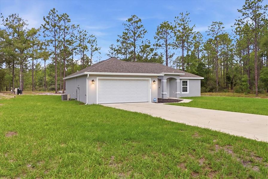 Front exterior of a new home in , Dunnellon, FL, highlighting curb appeal (Image 2). Front exterior of a new home in , Dunnellon, FL, highlighting curb appeal (Image 2).