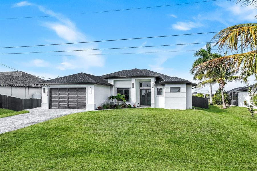 Front exterior of a new home in , Cape Coral, FL, highlighting curb appeal (Image 22).