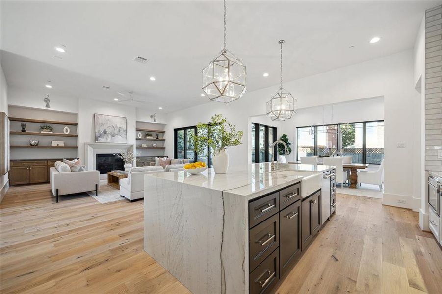 The airy and open layout creates a sense of space that transcends traditional boundaries, allowing the kitchen to effortlessly connect with the surrounding living areas. Natural light floods through well-placed windows, accentuating the clean lines and enhancing the bright and welcoming atmosphere