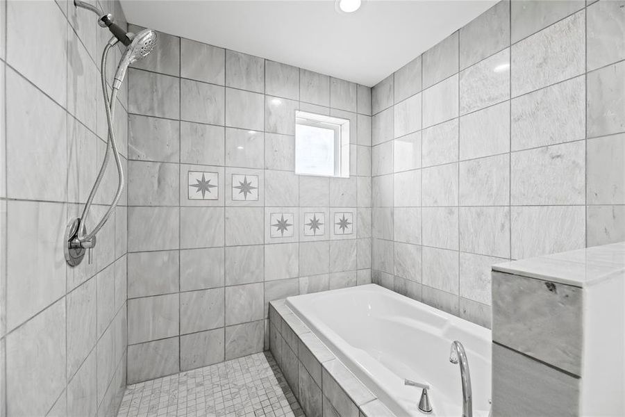 The design is all the way. Deep soaking tub with separate large open shower.