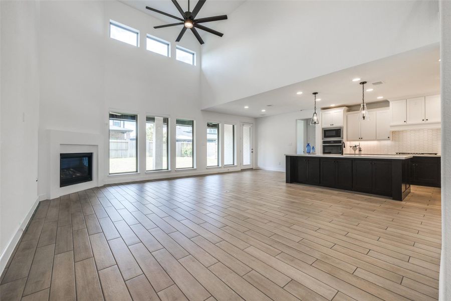 Very spacious open plan Living Room through to Kitchen and Breakfast Room, wall of windows give fabulous natural light, gas fire