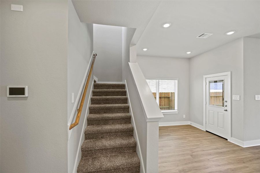 Upstairs to the bedrooms and additional flex space.