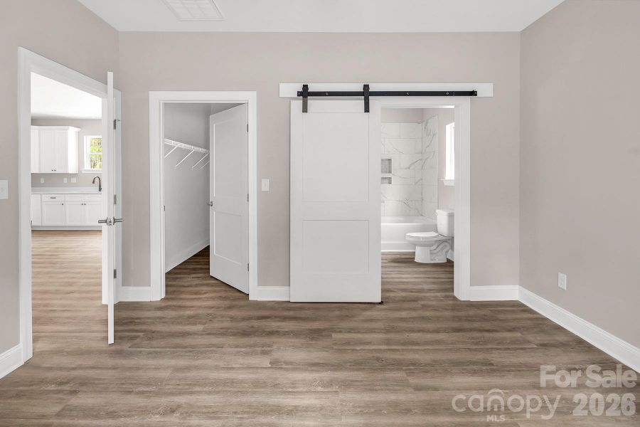 Primary Suite with walk in closet and en-suite bathroom.