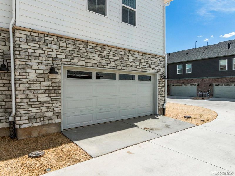 Front exterior of a new home in Skyview at High Point, Aurora, CO, highlighting curb appeal (Image 24).