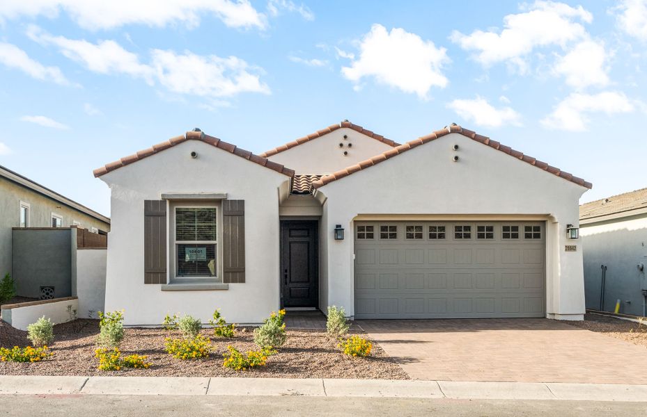 Front exterior of a new home in Regent Hills - Meadow Series, Buckeye, AZ, highlighting curb appeal (Image 2). Front exterior of a new home in Regent Hills - Meadow Series, Buckeye, AZ, highlighting curb appeal (Image 2).