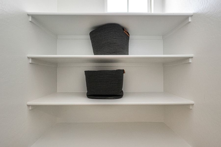 A shelf with a basket on it.